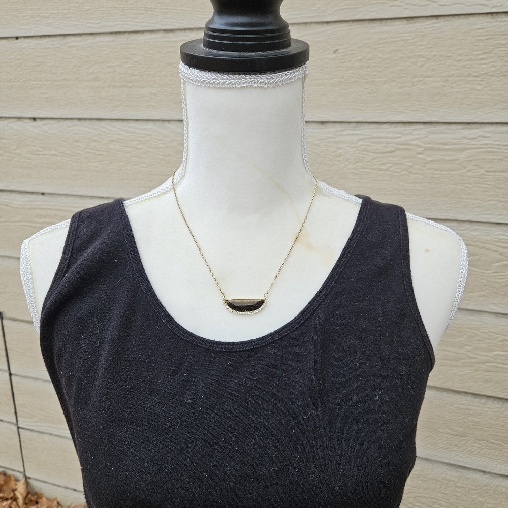 gold tone chain necklace with brown and rhinestone crescent pendant